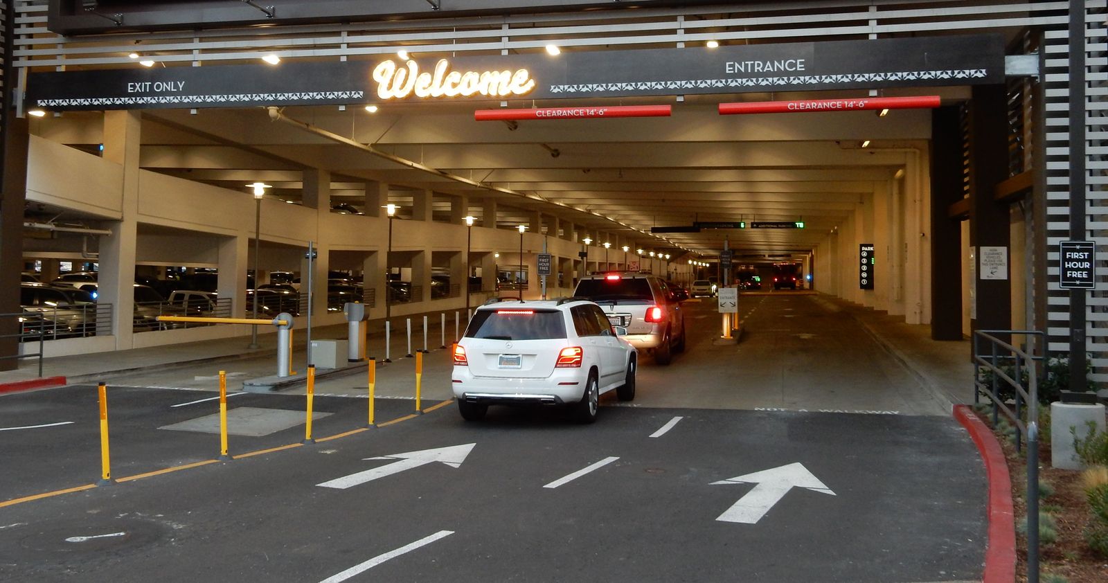 Entrance to a parking garage showing the word "welcome.